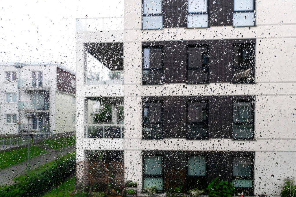 Rain drops on the window, residential house